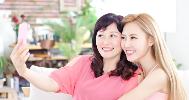 istock daughter selfie with mother 948997126