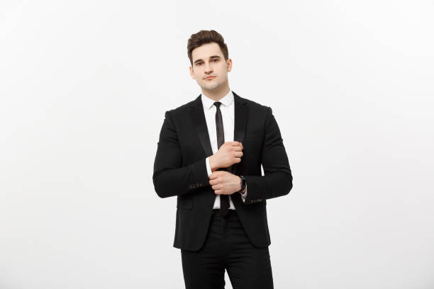 istock Business Concept: Handsome Man Happy Smile Young Handsome Guy in smart suit posing over Isolated Grey Background. 948999654