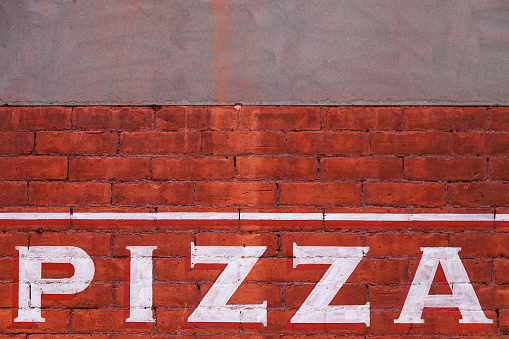 Pizza sign on wall
