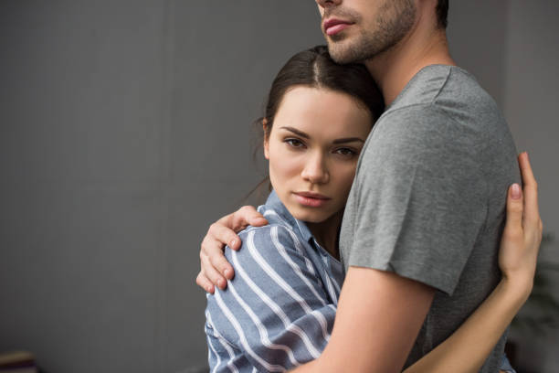 istock Brunette woman hugging her husband in bedroom 949024190