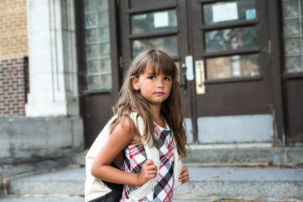 istock eight years old school girl 949025554