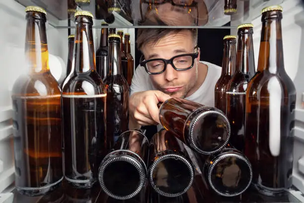 Photo of Fridge full of beer bottles
