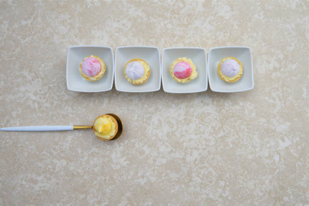 istock flat lay with pastry fruit tarts in a line 949031942