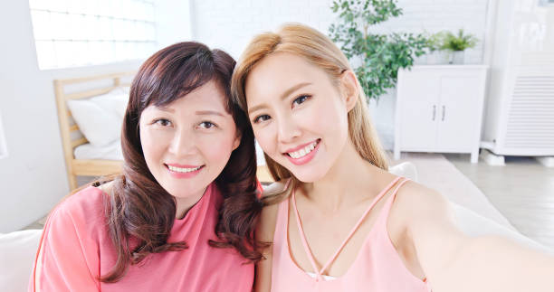 istock daughter selfie with mother 949033036