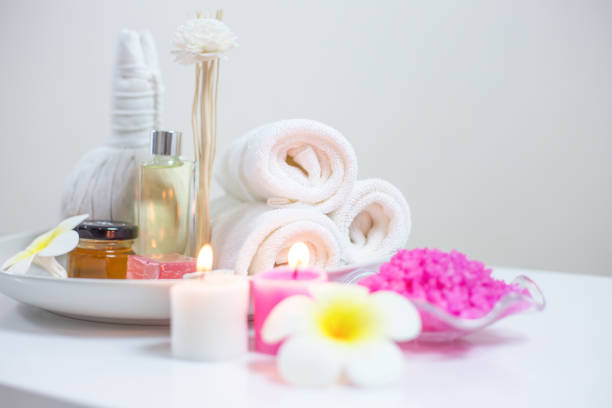 Beautiful composition of spa treatment on white wooden table