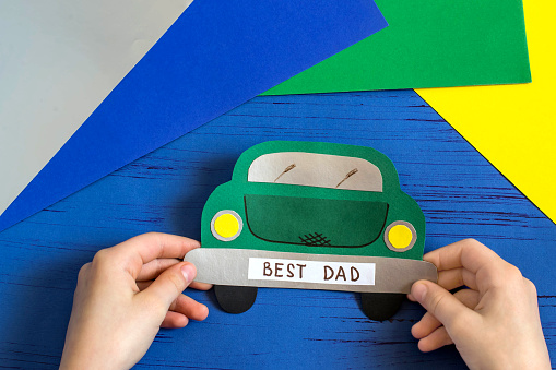 Making greeting card for Father's Day in shape of car. Children's art project. DIY concept. Step-by-step photo instruction. Step 10. Final result