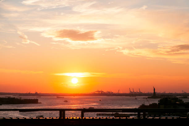 istock Sunset over east river in New York City 949053298