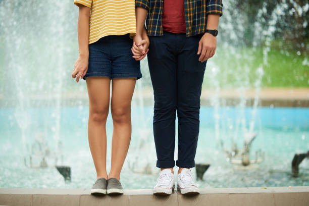 Couple in love Cropped image of young couple holding hands teen romance stock pictures, royalty-free photos & images