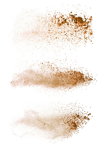 Explosión de polvo marrón coloreada Resumen aislado sobre fondo blanco. photo