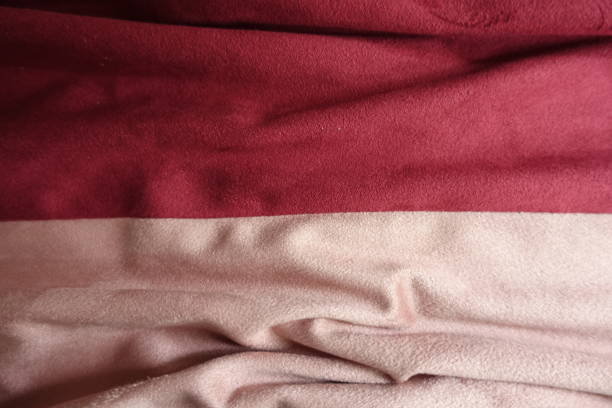 istock Draped artificial suede fabric in pink and red 949066172