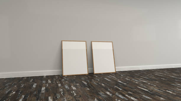 istock Blank white poster in wooden frame standing on the floor 949067904