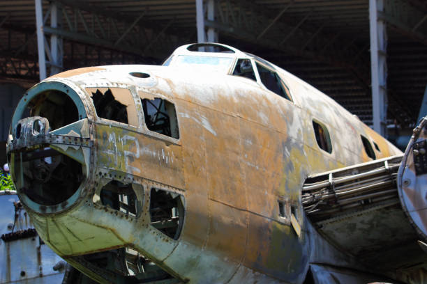 small white plane in hangar