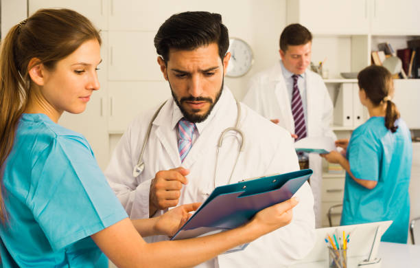 istock Doctors having discussion in medical office 949071706