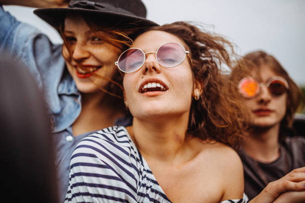 istock Excited group of friends having fun in a convertible 949071996