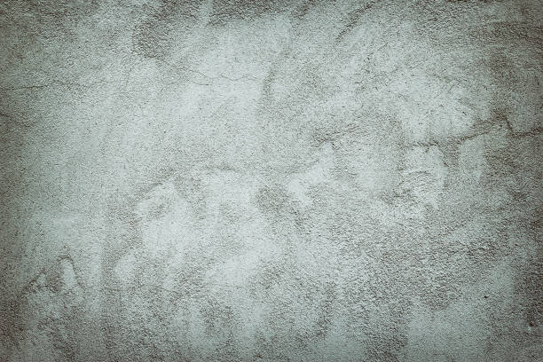 istock Gray plastered concrete wall with high details as background 949077778