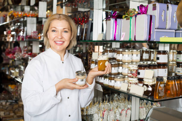 istock Woman selling chocolates and confectionery 949086404