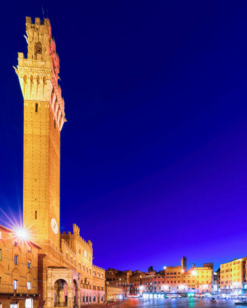 istock Torre del Magnia Tower on Piazza Campo Square Siena twilight 949086694