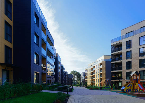 istock Children playground at complex of buildings quarter 949087584
