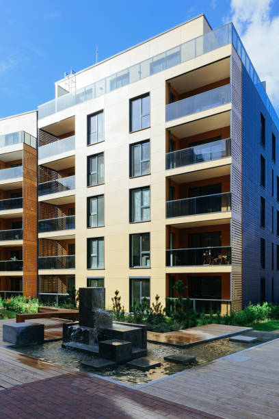 istock Fountain at complex of apartment residential buildings 949087664