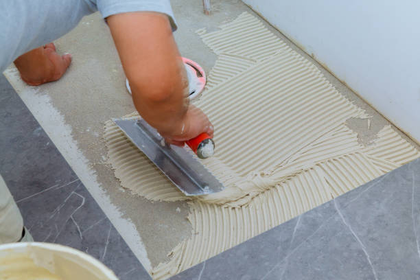 istock Ceramic tiles and tools for tiler. Floor tiles installation. Home improvement, renovation 949089998