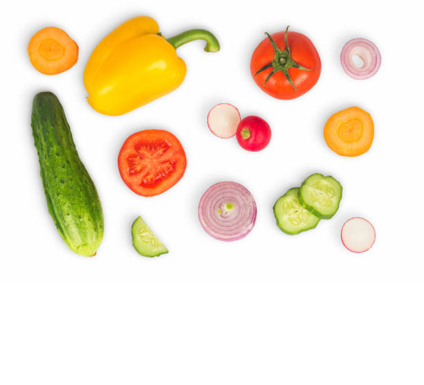 istock Vegetable mix on white isolated background. Fresh yellow pepper, chopped tomatoes, onion, round cucumber slice, carrot, radish. The concept of a healthy lifestyle. Vegetarian food. 949090202