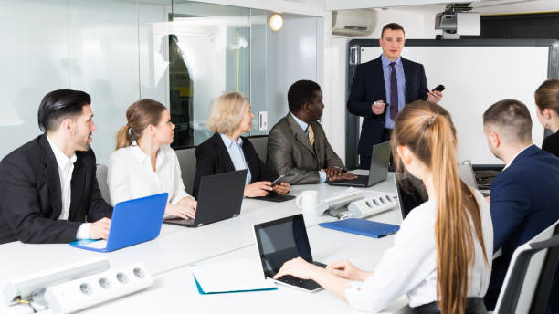 istock boss discussing new business project with  team 949090226