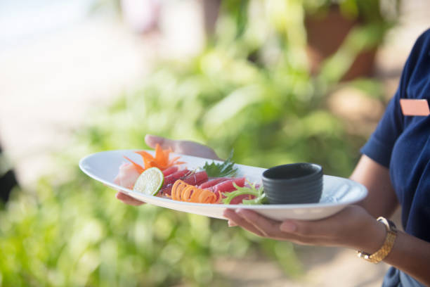 istock Serving seafood in sidewalk cafe 949094738
