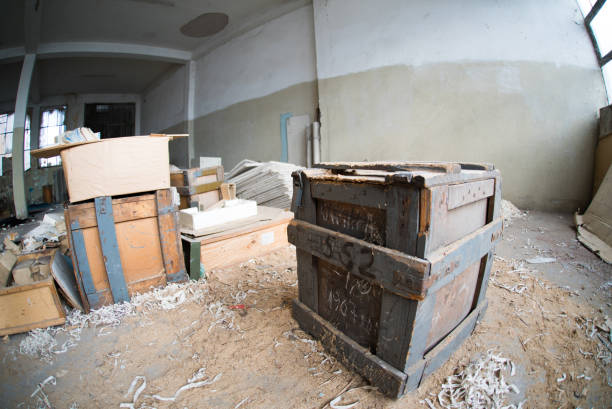 Rows of rustic wooden boxes, many with labels or papers attached, are neatly arranged on aged shelves, suggesting a vintage storage system or archive.