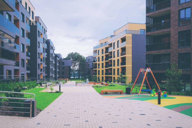 istock Modern apartment residential buildings quarter with benches 949099174