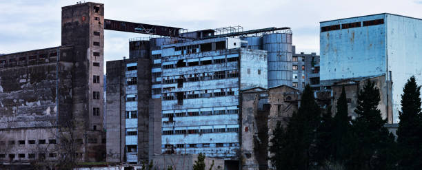 Old industrial complex Old abandoned industrial complex for processing wheat in Mostar, Bosnia & Herzegovina, destroyed in war during Yugoslavian breakdown during 1990s. former yugoslavia stock pictures, royalty-free photos & images