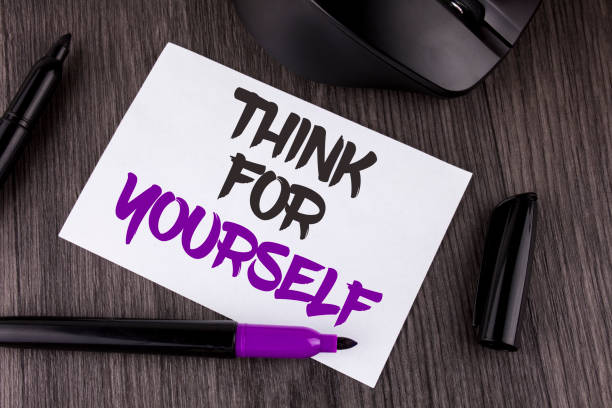 istock Handwriting text writing Think For Yourself. Concept meaning Have an independent Mind Attitude Make your own decisions written on White Sticky Note Paper on the wooden background Mouse Markers 949104136