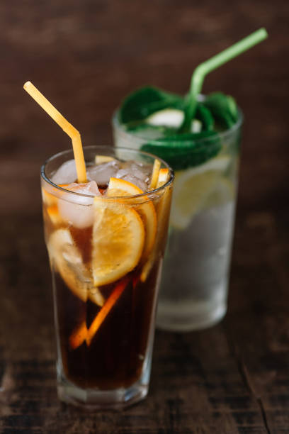 istock Two glasses of lemonade on a wooden background 949107766