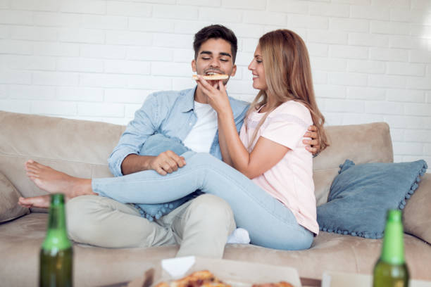 istock Young couple relaxing in their apartment 949110900