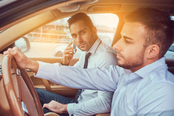 istock A handsome businessman in luxury car 949111370