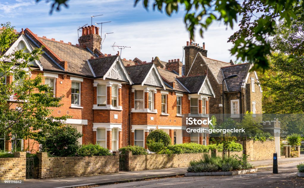 Traditional London terraced houses A street of traditional terraced houses, on a quiet leafy street in East London. House Stock Photo