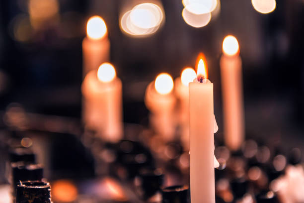 istock burning candles in the church 949115064