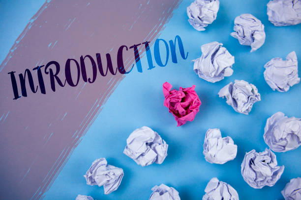 istock Writing note showing  Introduction. Business photo showcasing First part of a document Formal presentation to an audience written on Painted background Crumpled Paper Balls next to it. 949118912