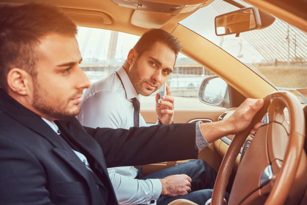 istock A handsome businessman in luxury car 949119250