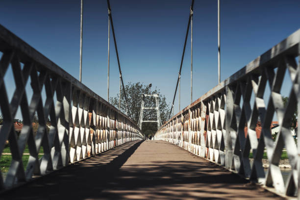 istock Suspension bridge over the river 949119690