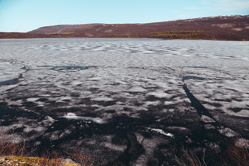 Still ice in the lake even if it is summer, near Utsjoki in northern Finland where the snow and ice melt very late in the summer