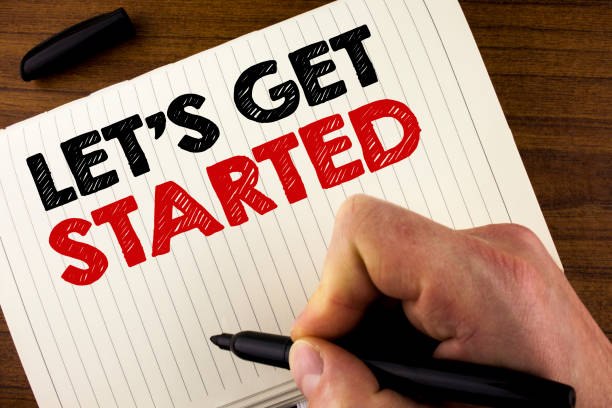 istock Conceptual hand writing showing Lets Get Started. Business photo showcasing beginning time motivational quote Inspiration encourage written by Man on Notebook Book on Wooden background Marker. 949124114