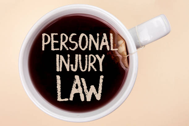 istock Handwriting text writing Personal Injury Law. Concept meaning guarantee your rights in case of hazards or risks written on Tea in a Cup on the plain background Tea Bag. 949126732