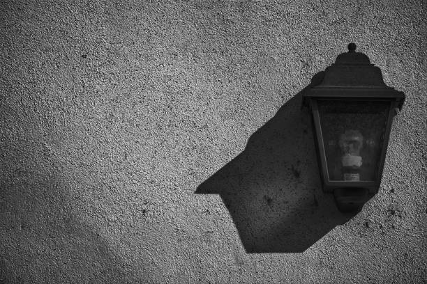 Vintage lantern on the wall, postcard sample, background with street lamp.