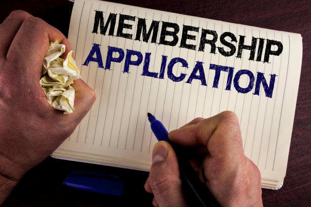 istock Writing note showing  Membership Application. Business photo showcasing Registration to Join a team group or organization written by Man on Notebook Book on wooden background Pen Crumpled Paper 949127580