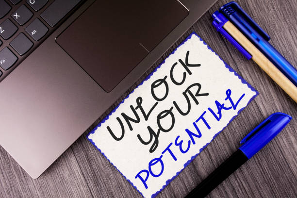 istock Word writing text Unlock Your Potential. Business concept for Reveal talent Develop abilities Show personal skills written on White Sticky Note Paper on the wooden background Laptop Markers 949131284