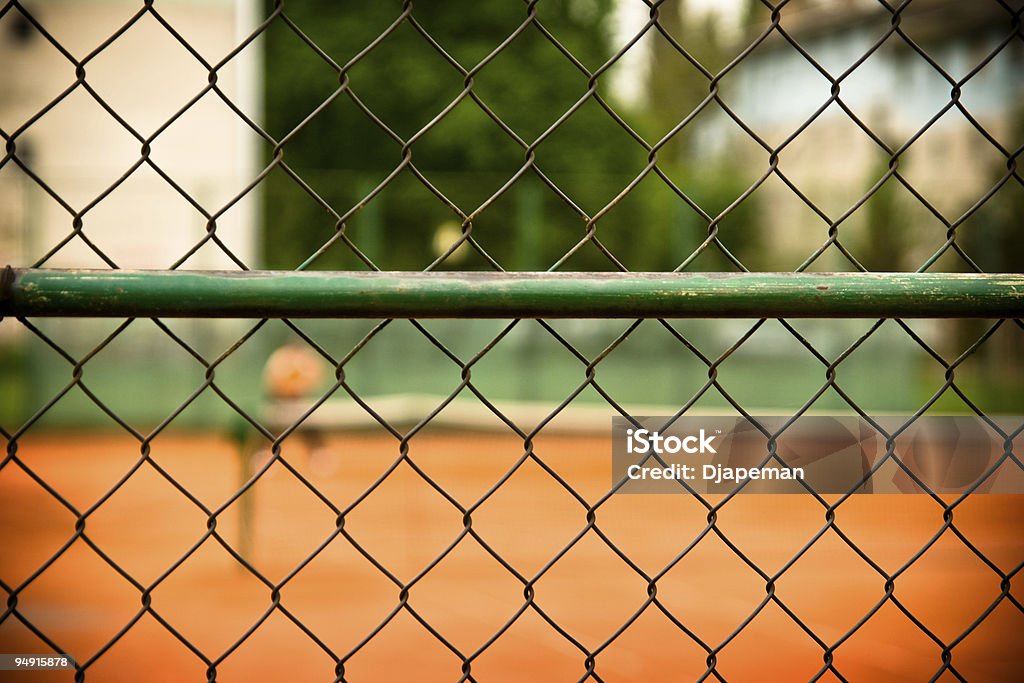 テニスフェンス - オレンジ色のロイヤリティフリーストックフォト