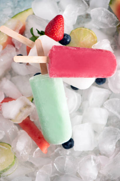 istock Homemade  popsicles on ice and fruits, top view 949163910