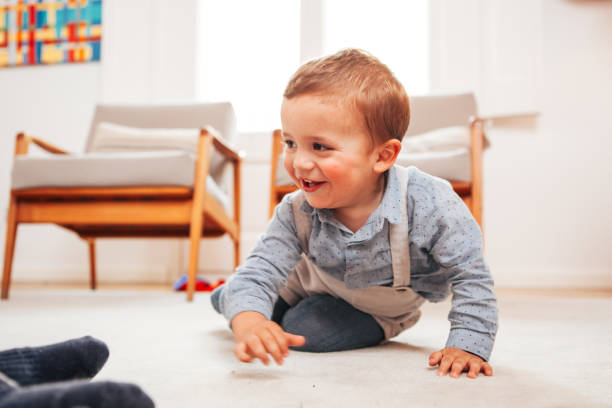 istock Toddler smiles playing at home 949167150
