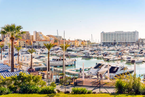 Marina full of luxurious yachts in touristic Vilamoura, Algarve, Portugal Marina full of luxurious yachts in touristic Vilamoura, Quarteira, Algarve, Portugal faro district portugal photos stock pictures, royalty-free photos & images