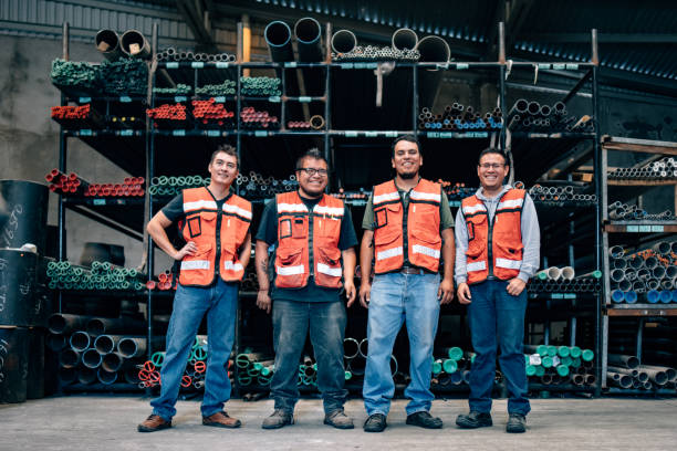 Warehouse People working on pipe and seal ring distribution warehouse in Mexico organised group photo stock pictures, royalty-free photos & images